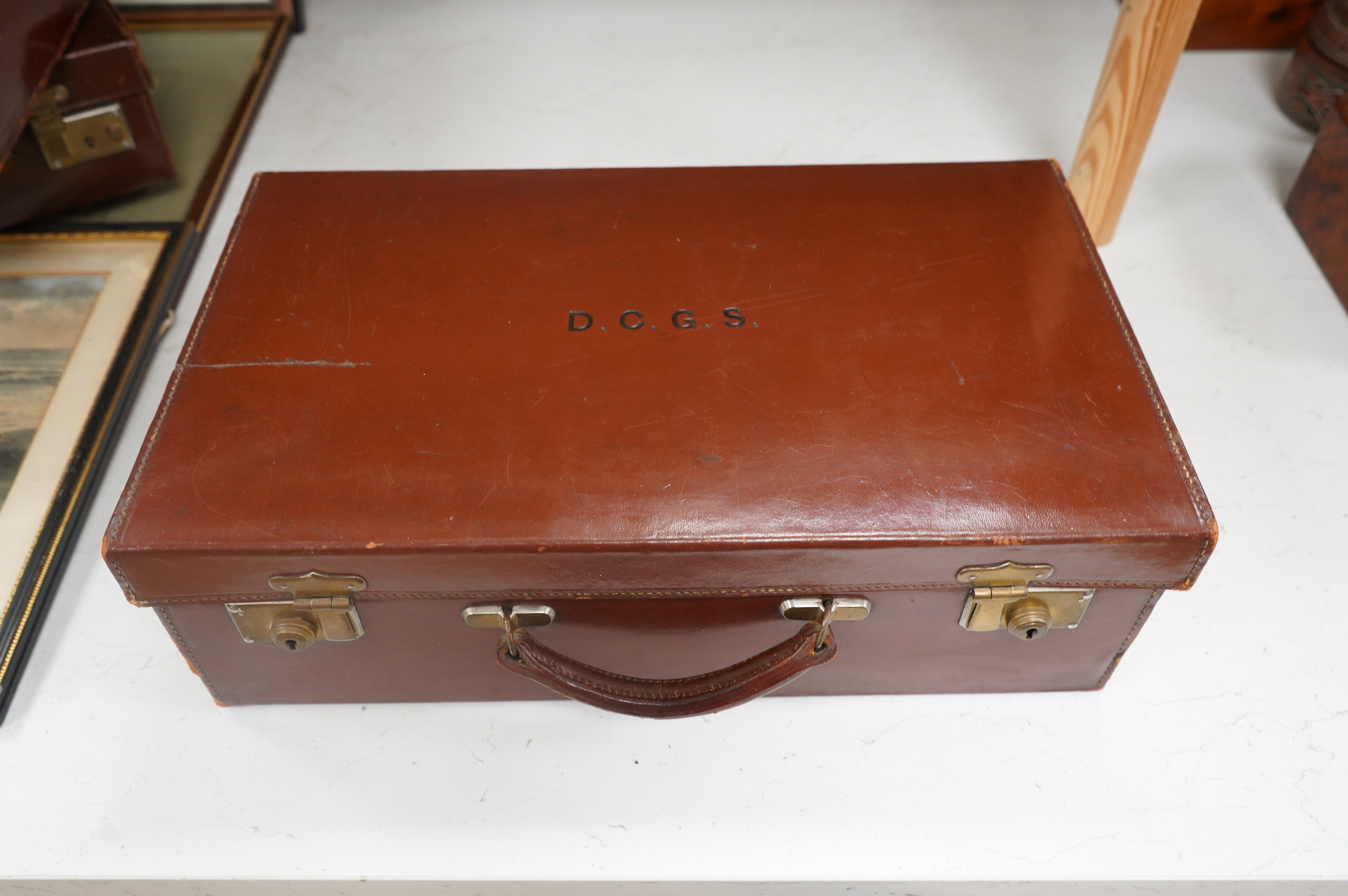 Three small vintage leather cases, largest 45cm wide